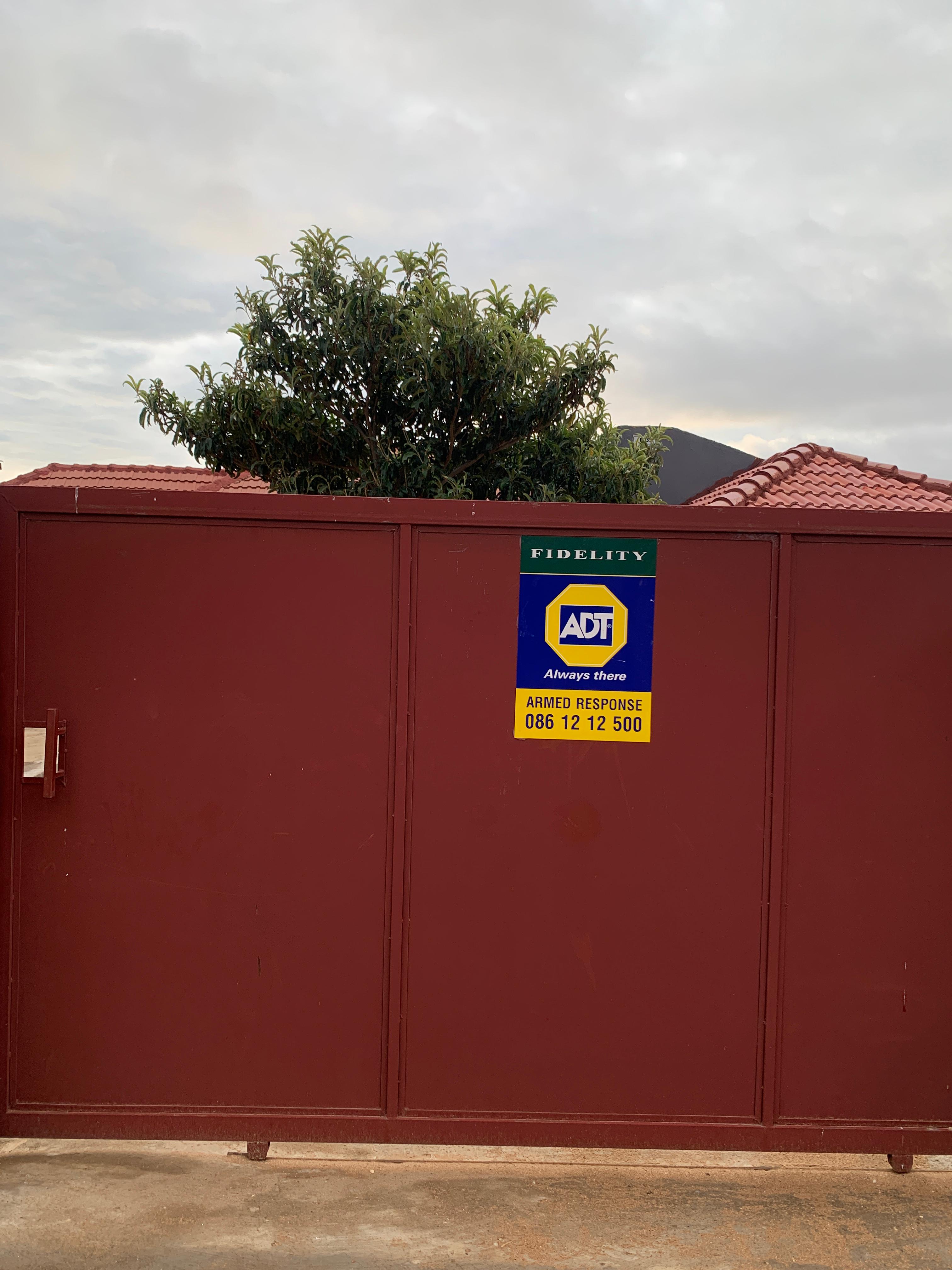 Secured gate with ADT sign at Maps Student Accommodation
